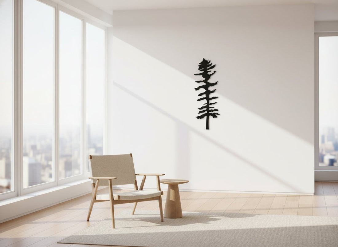 Handcrafted black metal pine tree wall art silhouette displayed in a modern minimalist living room, Ontario-made metal decor by Castle Stone Ironworks