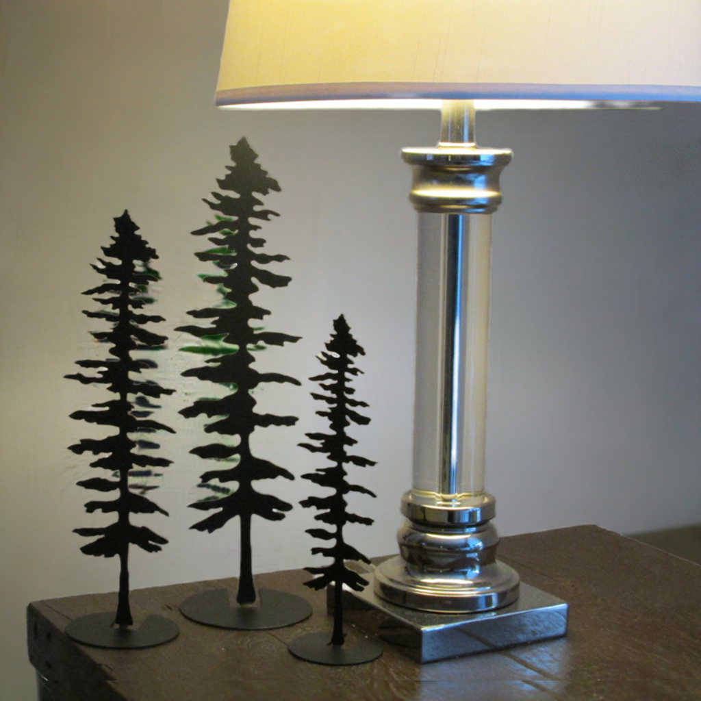 Handcrafted steel pine tree displayed as home decor, Ontario-made freestanding metal art by Castle Stone Ironworks